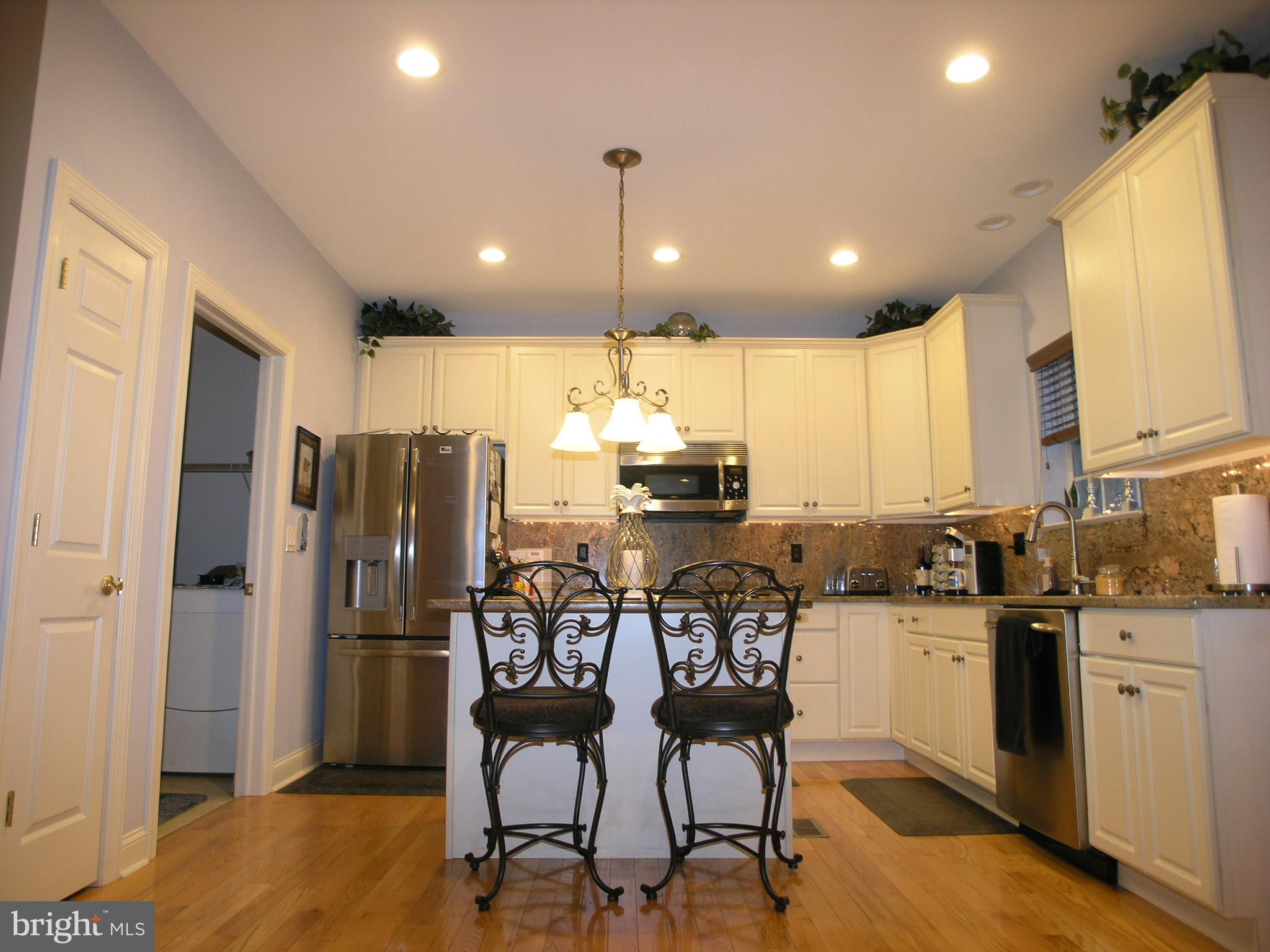 118 Casey Lane Bensalem, PA 19020 - Photo 4 of 26 a kitchen with stainless steel appliances kitchen island granite countertop a refrigerator and a stove top oven