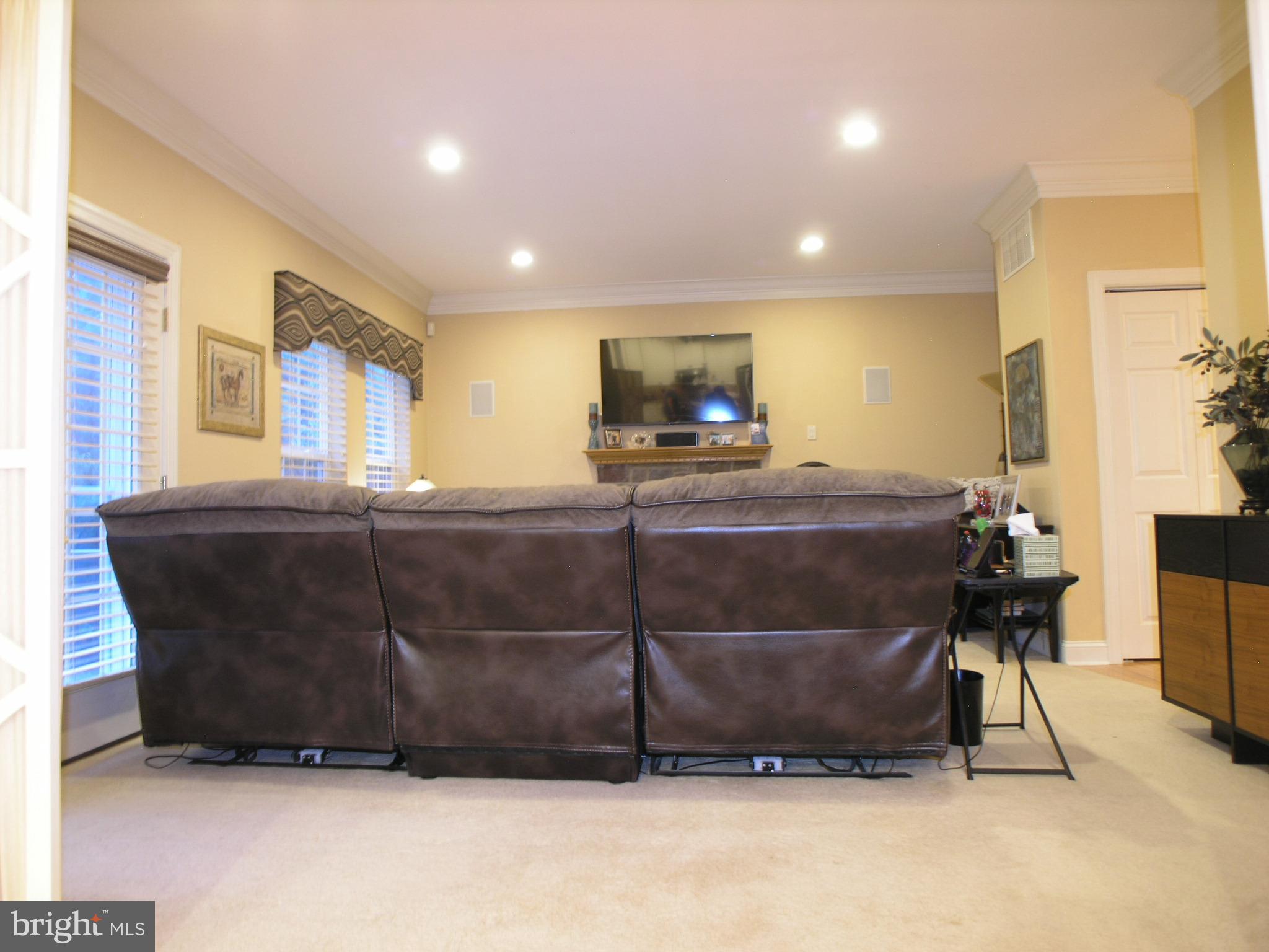118 Casey Lane Bensalem, PA 19020 - Photo 10 of 26 a living room with a couch and a flat screen tv