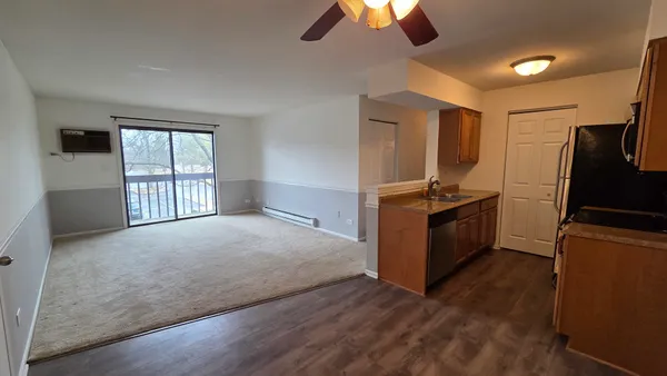 a kitchen with stainless steel appliances granite countertop a stove and a refrigerator