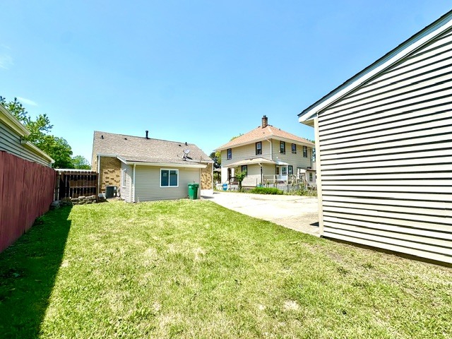 513 Cookane Avenue Elgin, IL 60120 - Photo 23 of 26 a front view of a house with a yard and garage