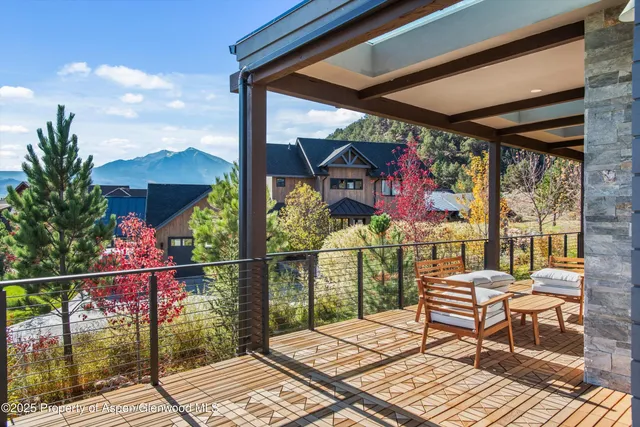 a view of a balcony with chairs