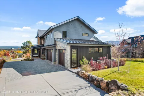 a view of a terrace with a table and chairs