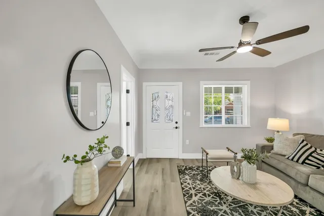 a living room with furniture and a table