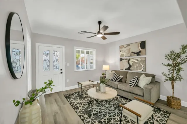 a kitchen with a dining table chairs and chandelier