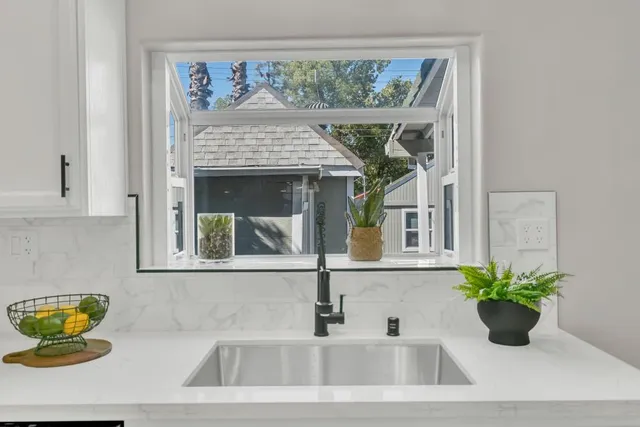 a spacious bathroom with a double vanity sink toilet and shower