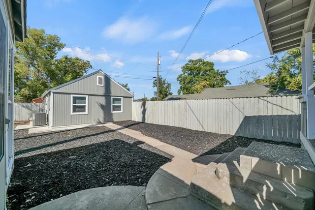 a kitchen with refrigerator and cabinets