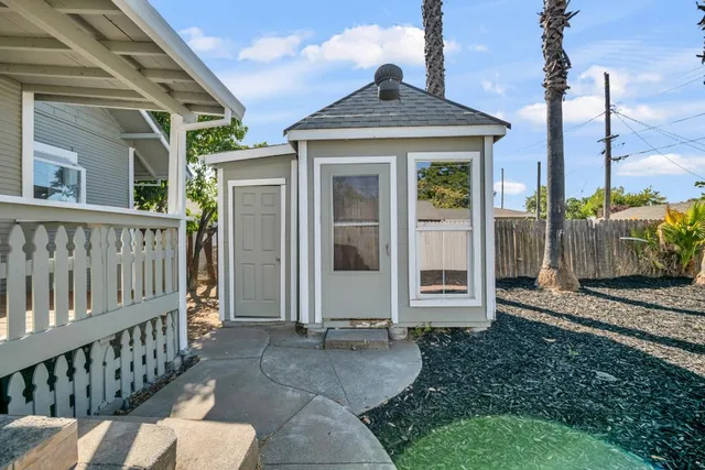 a living room with furniture potted plant and a fireplace