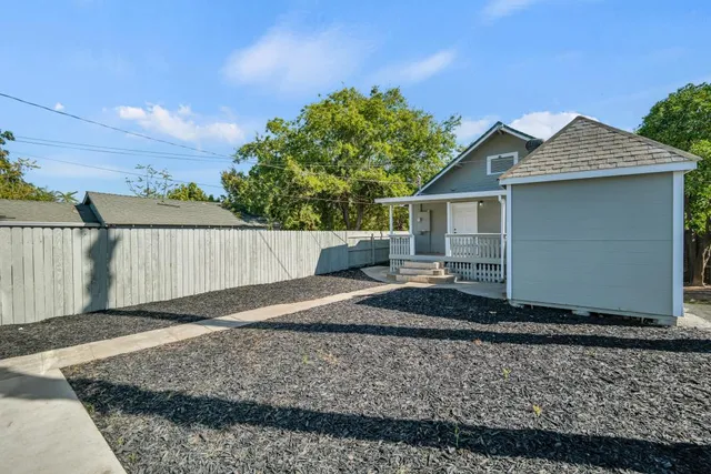 a view of an empty room and wooden floor