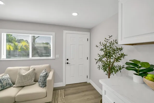 an aerial view of residential houses with city view