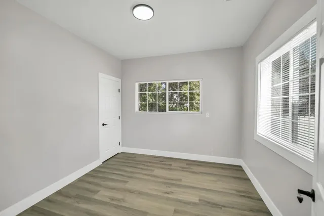 a bathroom with a sink mirror and a bathtub