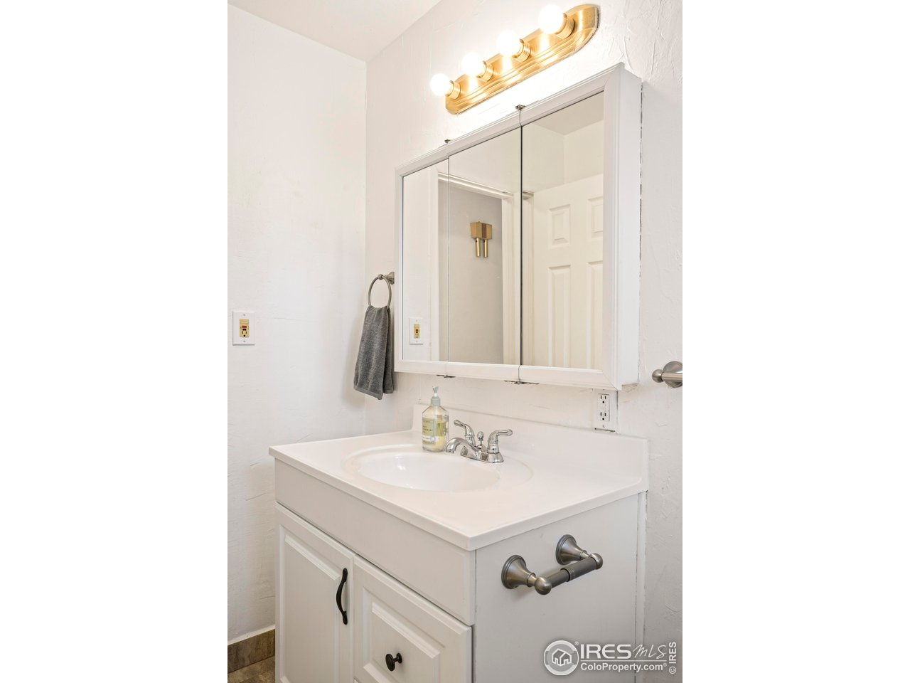 3120 Jefferson Street Boulder, CO 80304 - Photo 15 of 23 a bathroom with a sink and a mirror