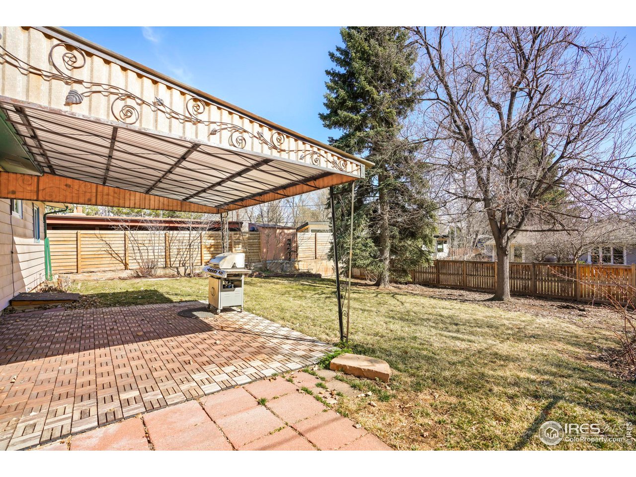 3120 Jefferson Street Boulder, CO 80304 - Photo 19 of 23 a backyard of a house with a tree