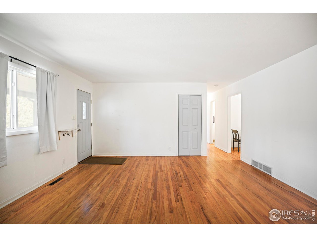 3120 Jefferson Street Boulder, CO 80304 - Photo 5 of 23 a big room with wooden floor and windows
