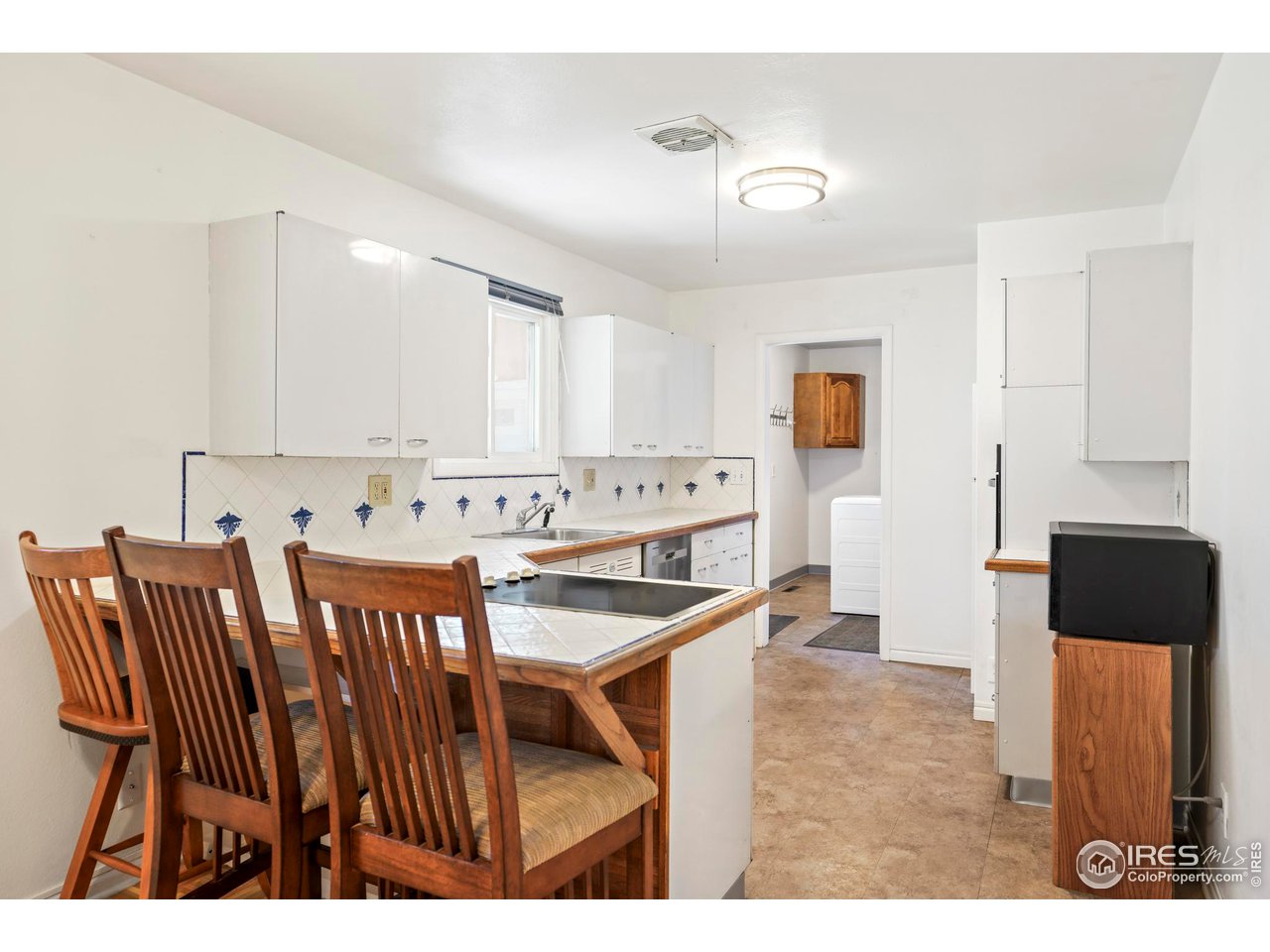 3120 Jefferson Street Boulder, CO 80304 - Photo 7 of 23 a view of kitchen with cabinets table and chairs