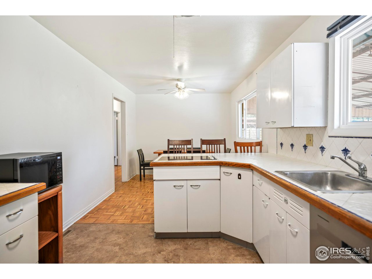 3120 Jefferson Street Boulder, CO 80304 - Photo 8 of 23 a kitchen with a sink cabinets and window