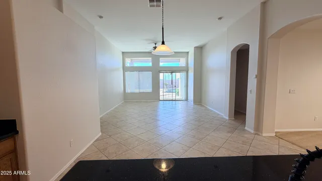 a kitchen with stainless steel appliances granite countertop a stove microwave and cabinets