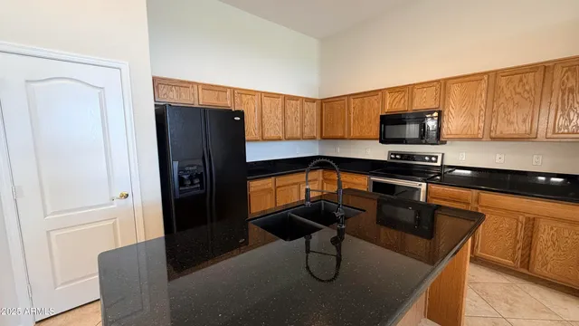 a view of a hallway with wooden cabinet