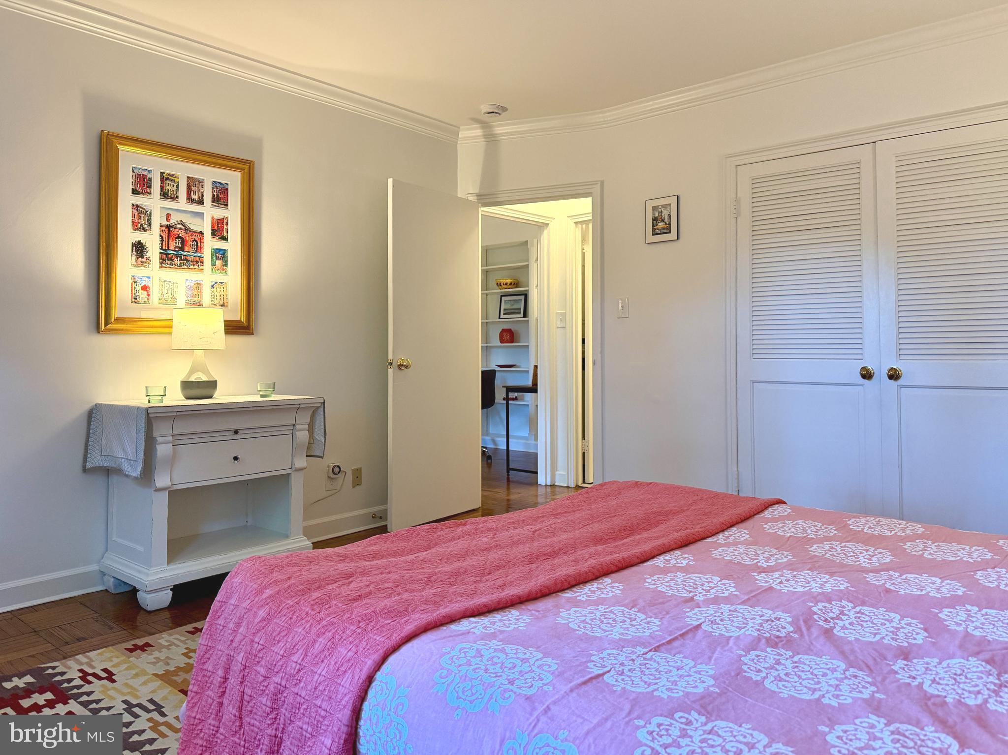 2500 Q Street Northwest, Unit 307 Washington, DC 20007 - Photo 11 of 17 a bedroom with a bed and a window