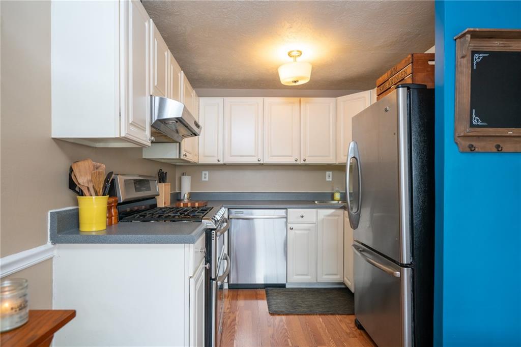 705 Countryside Drive McKees Rocks, PA 15136 - Photo 3 of 25 a kitchen with a refrigerator and a sink
