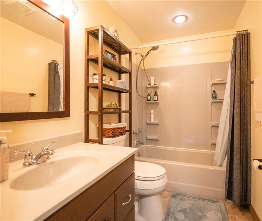 705 Countryside Drive McKees Rocks, PA 15136 - Photo 7 of 25 a bathroom with a sink a toilet and shower