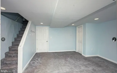 a view of a hall with stairs