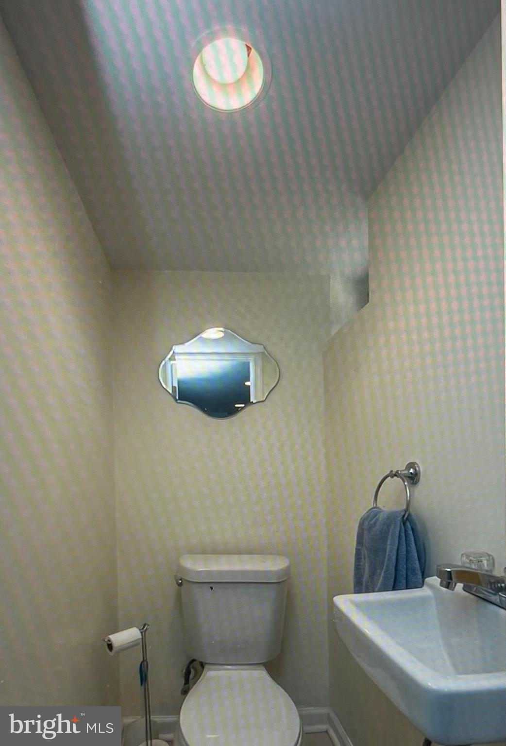 738 Eaton Road Drexel Hill, PA 19026 - Photo 14 of 16 a bathroom with a toilet a sink and mirror