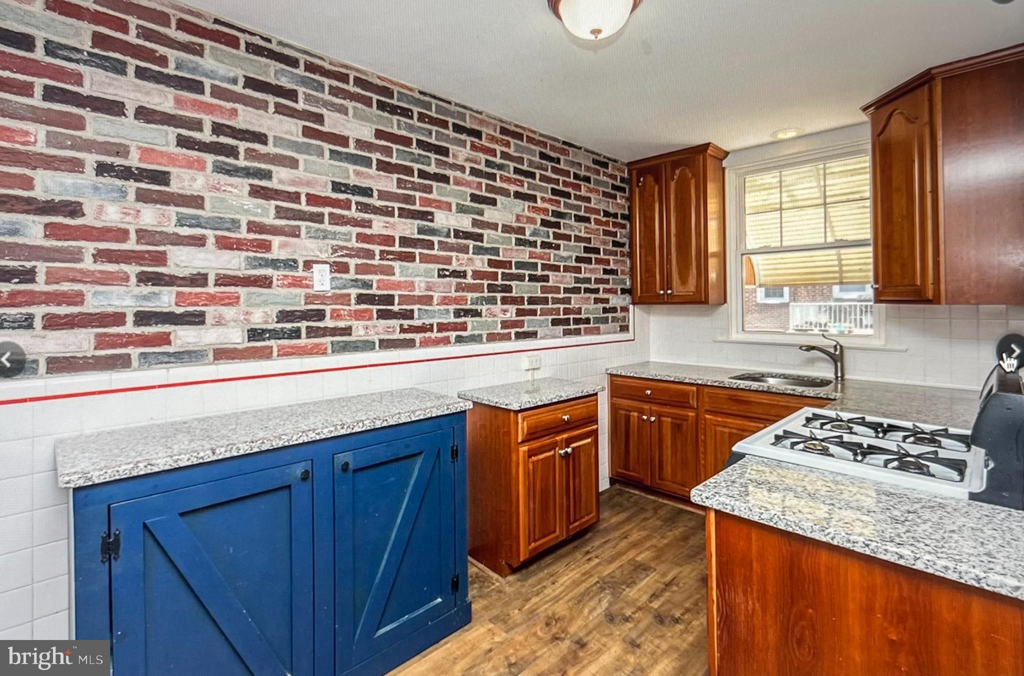 738 Eaton Road Drexel Hill, PA 19026 - Photo 6 of 16 a kitchen with granite countertop stainless steel appliances a sink stove and cabinets