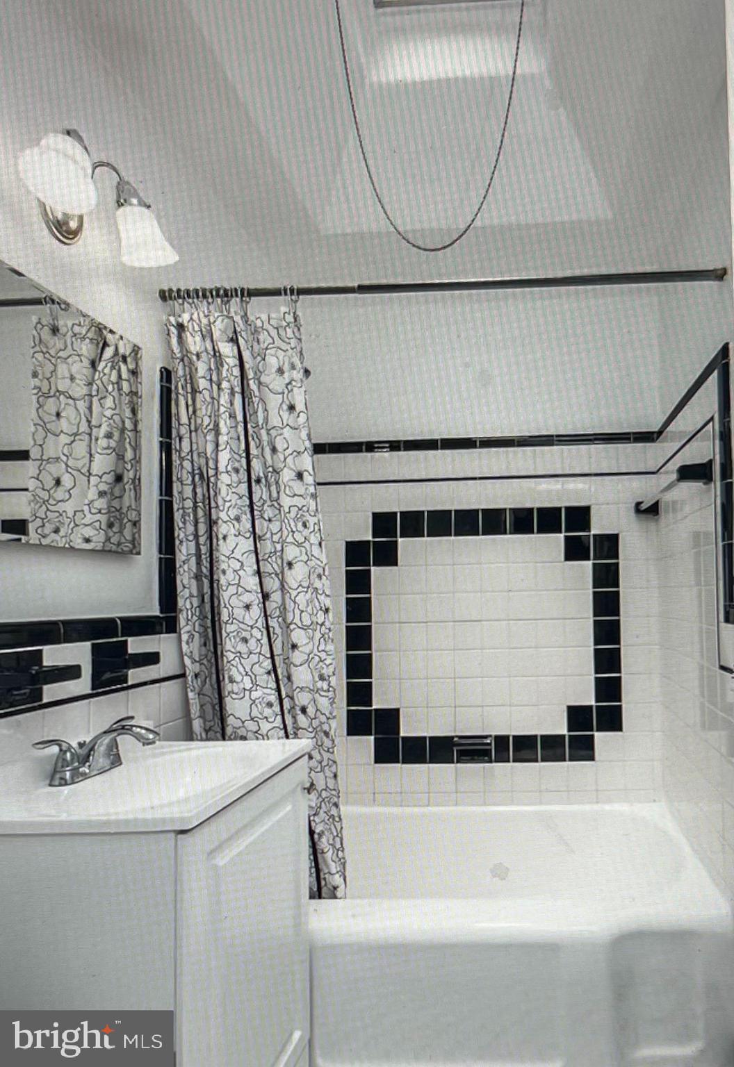 738 Eaton Road Drexel Hill, PA 19026 - Photo 10 of 16 a bathroom with a sink and a mirror