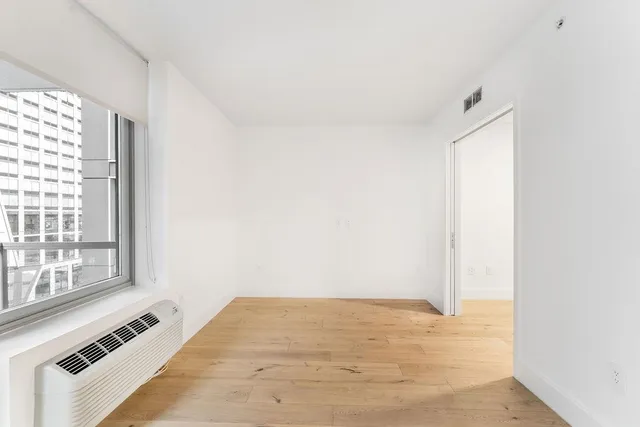 a view of an empty room with a window