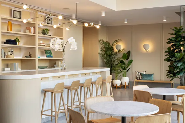 a dining room with furniture and chandelier