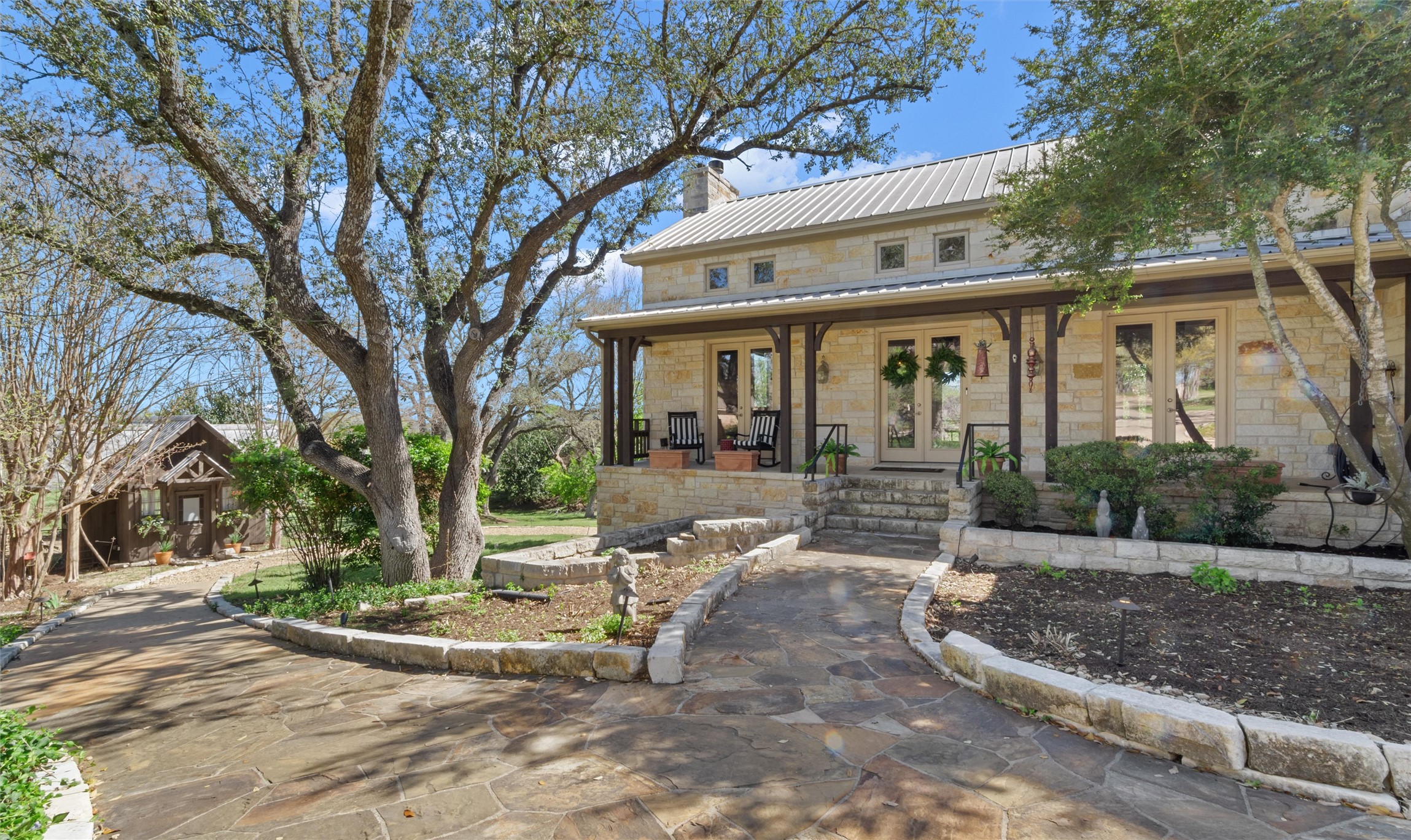 913 South Ridge Road Salado, TX 76571 - Photo 3 of 40 Large covered porch and path to guest cottage.