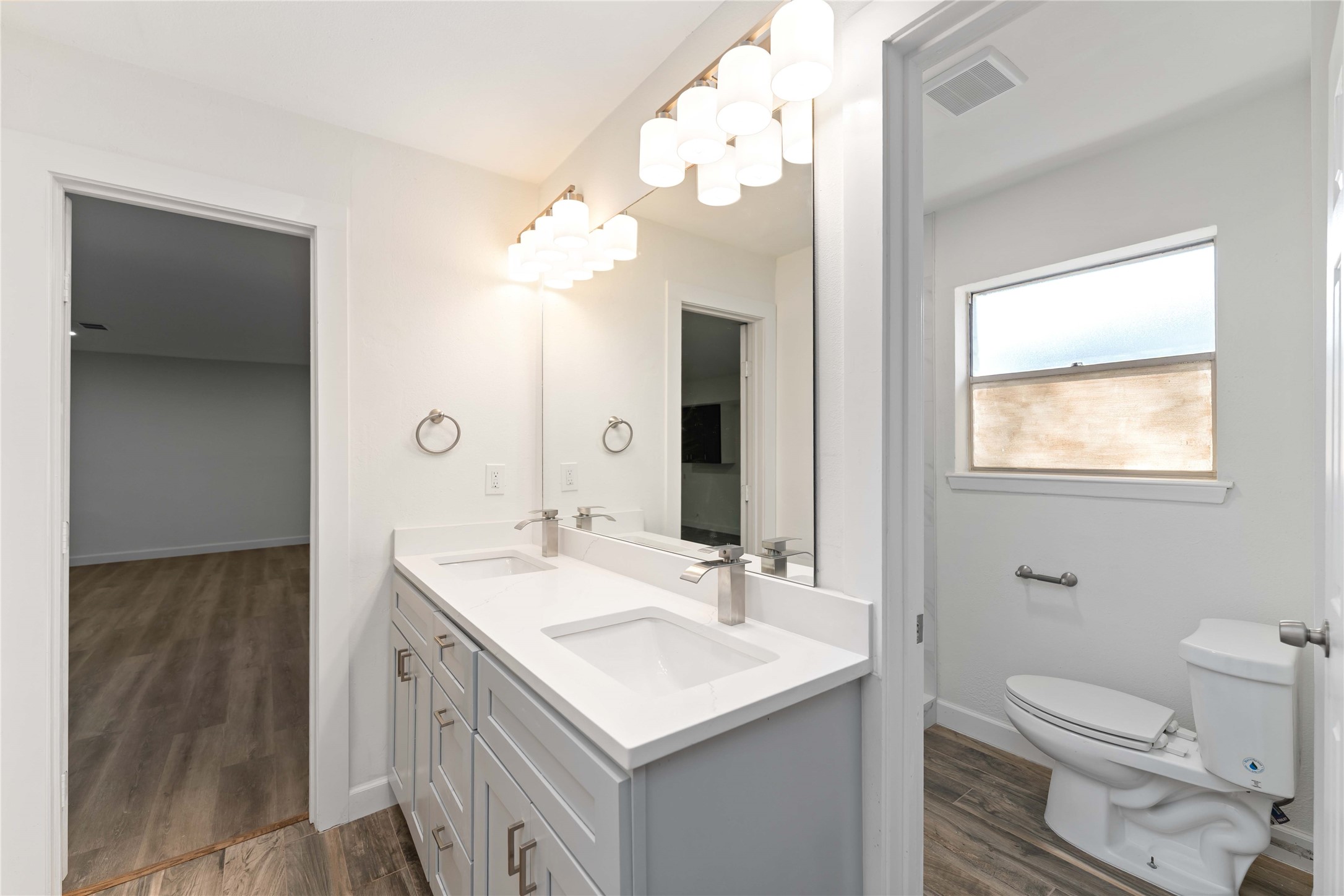 23122 Whispering Willow Drive Spring, TX 77373 - Photo 11 of 16 a bathroom with a sink a toilet and mirror