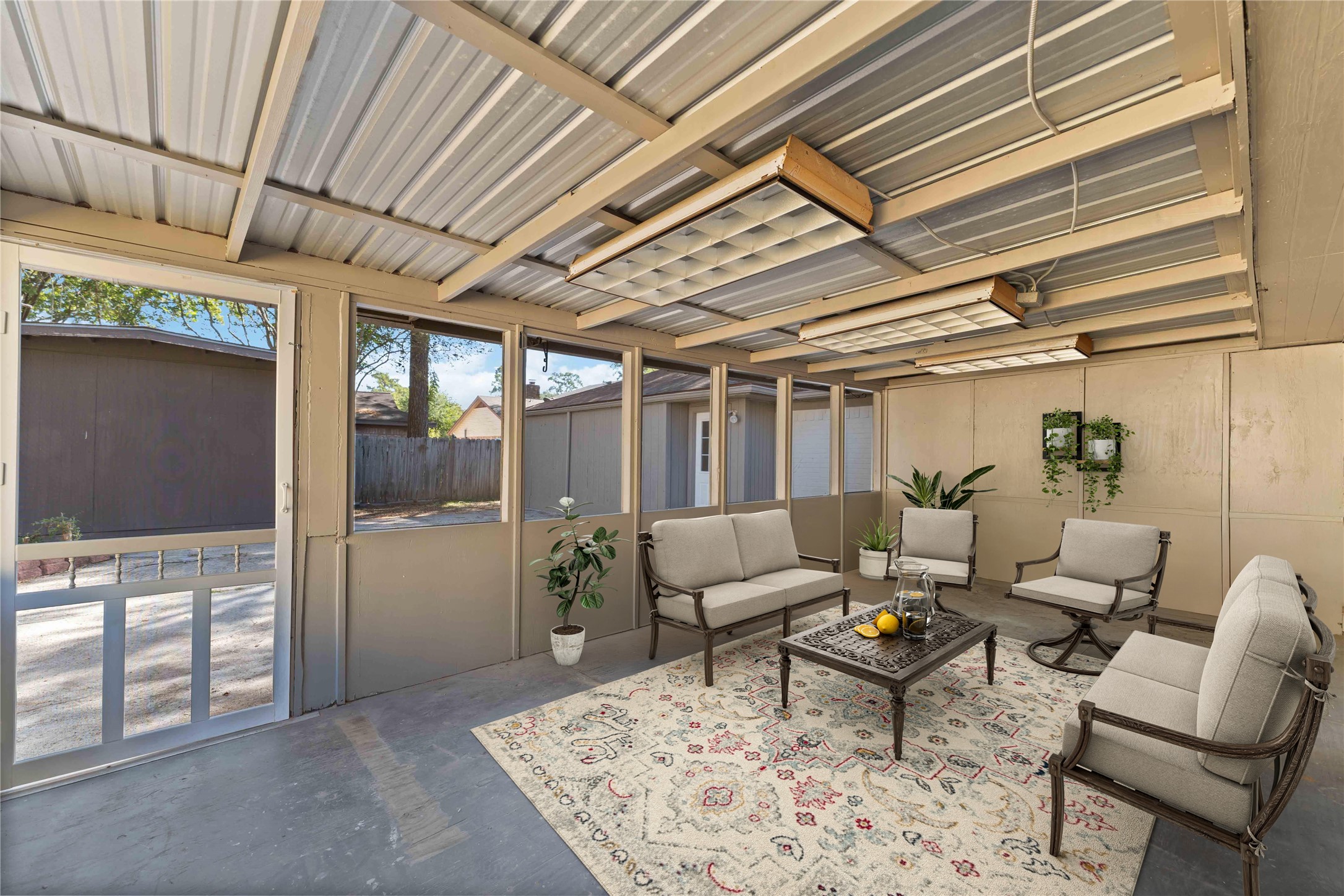 23122 Whispering Willow Drive Spring, TX 77373 - Photo 14 of 16 a living room with furniture and a chandelier