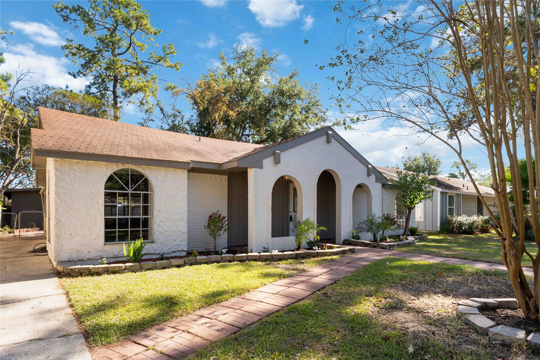 23122 Whispering Willow Drive Spring, TX 77373 - Photo 2 of 16 a front view of a house with swimming pool