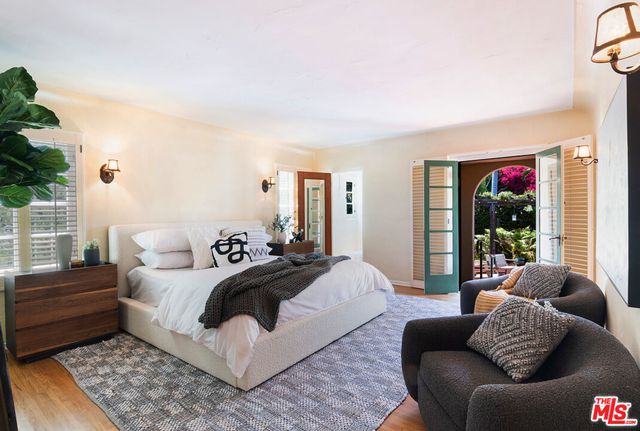 a bedroom with a bed and a couch