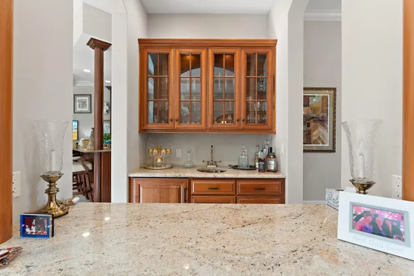 a kitchen with stainless steel appliances granite countertop a stove and a refrigerator