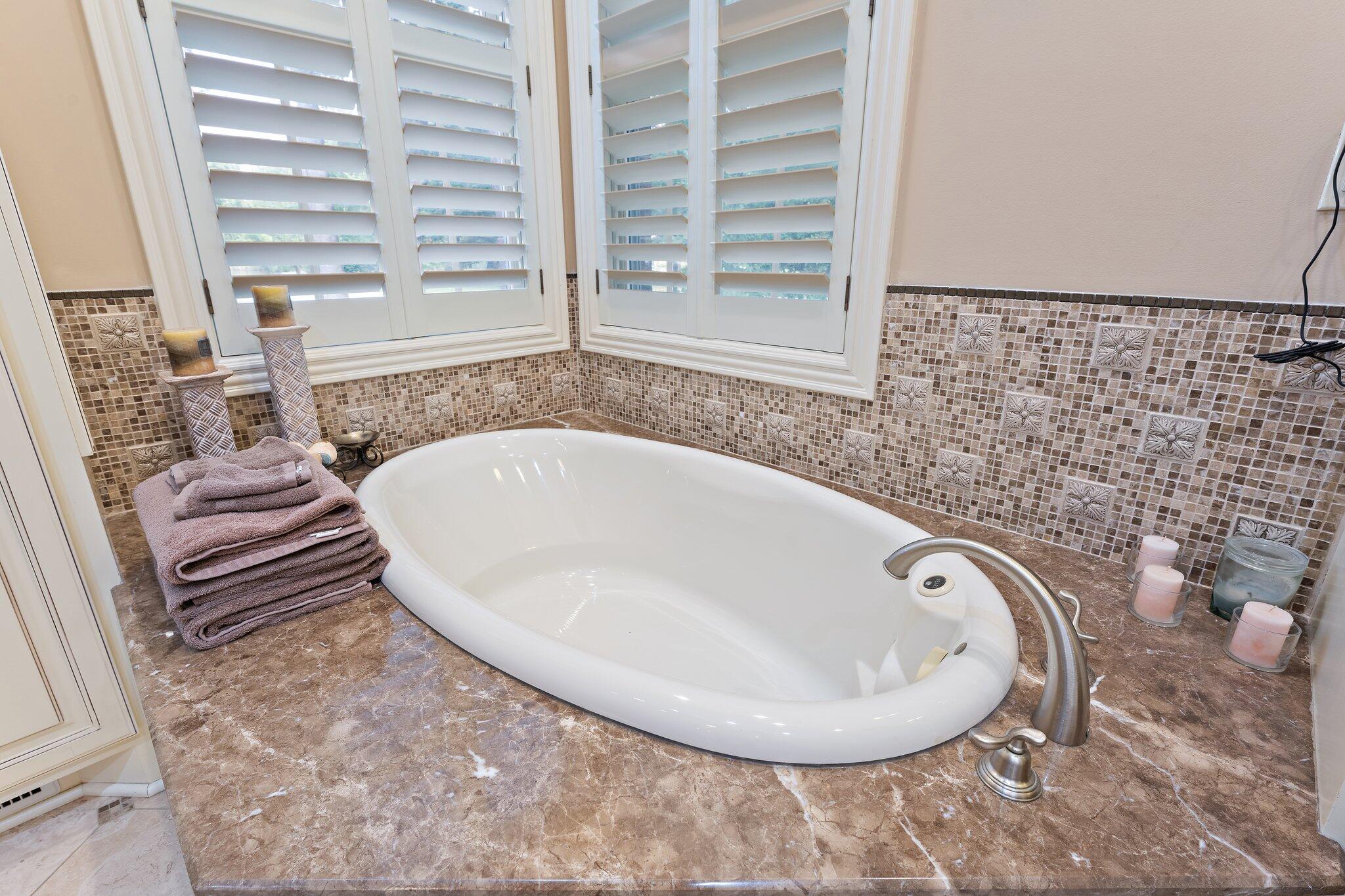 1191 Churchill Lane Crown Point, IN 46307 - Photo 36 of 80 a bathroom with a bathtub and next to a window