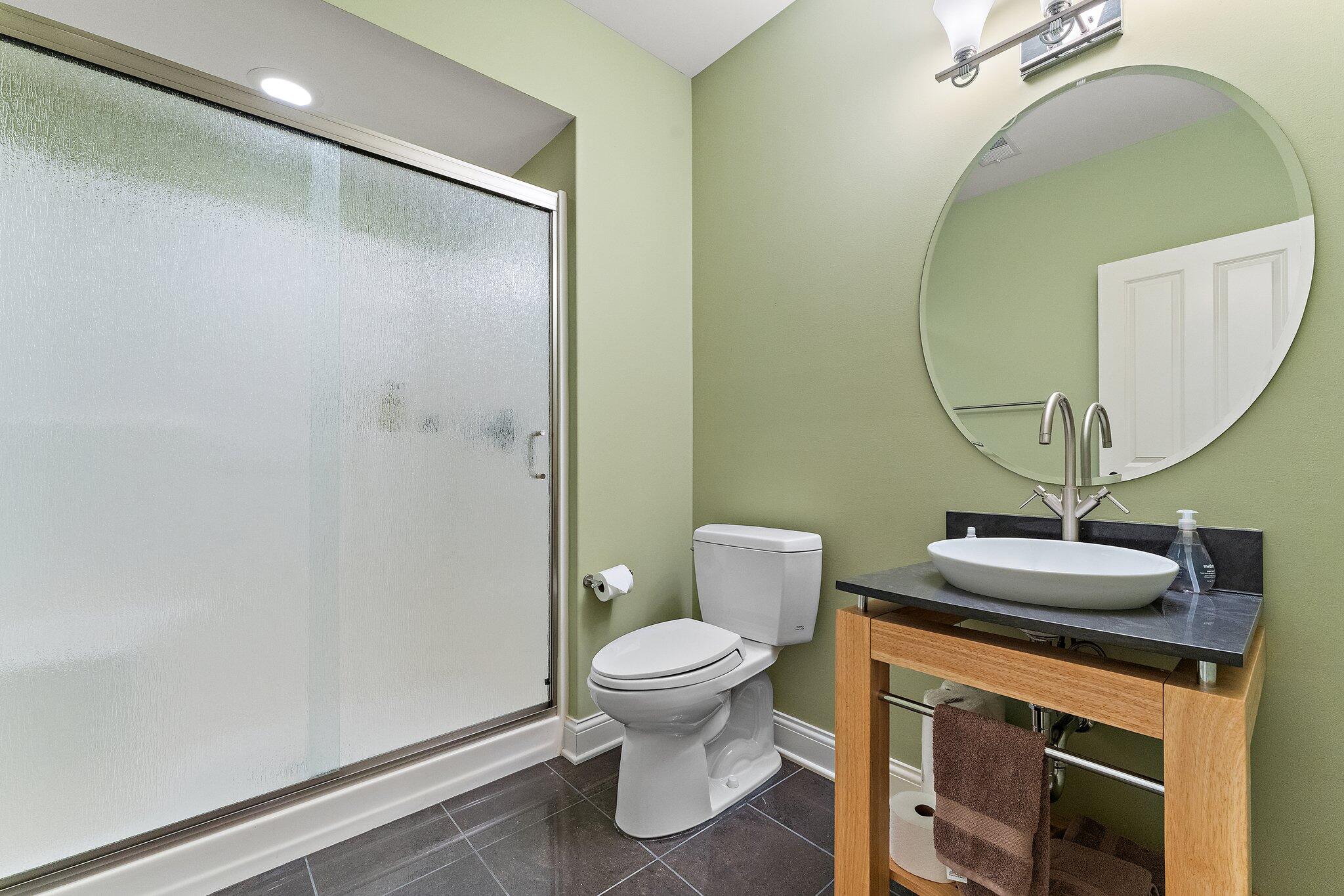 1191 Churchill Lane Crown Point, IN 46307 - Photo 50 of 80 a bathroom with a sink a toilet and a mirror