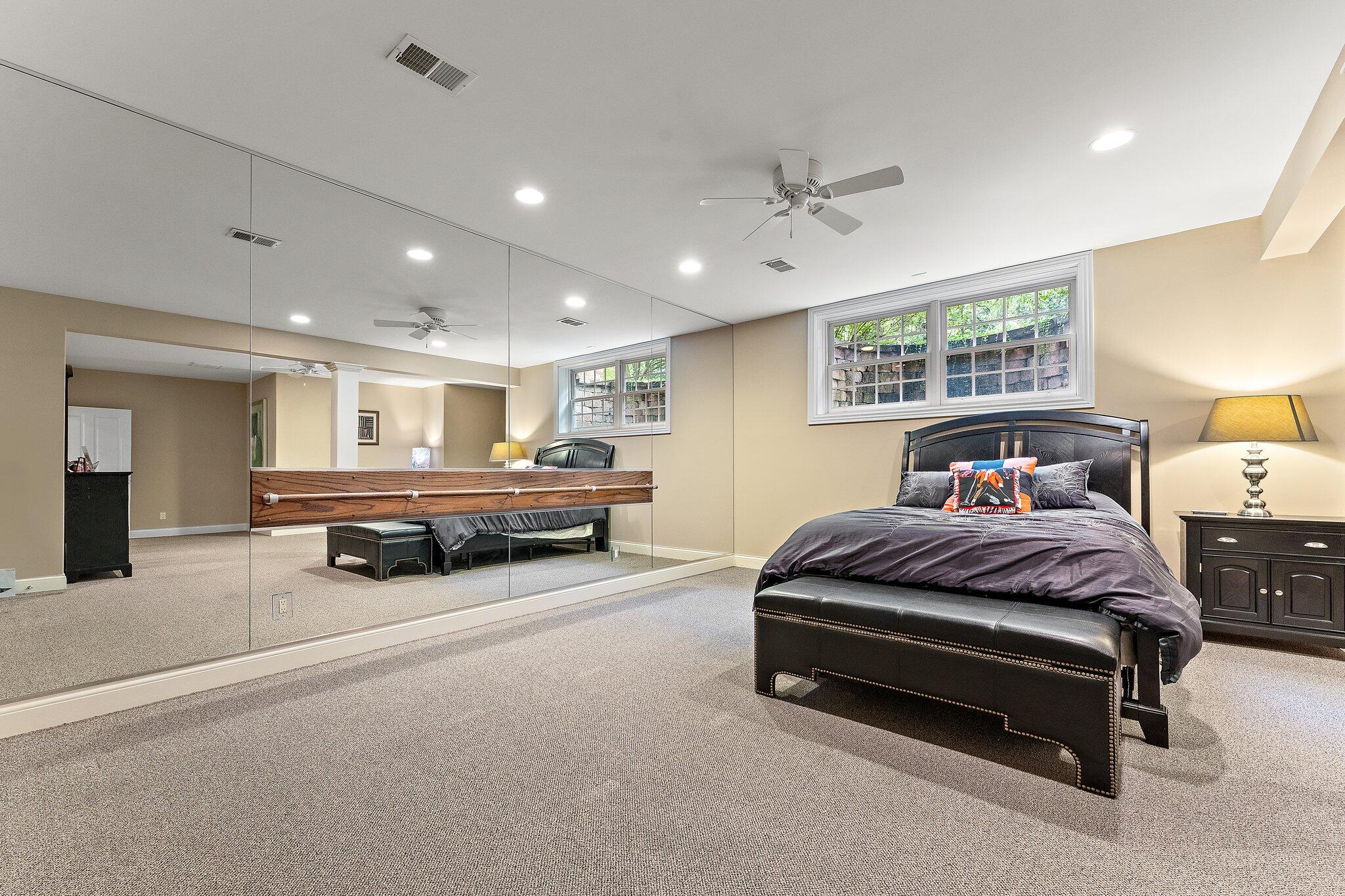 1191 Churchill Lane Crown Point, IN 46307 - Photo 51 of 80 a spacious bedroom with a bed and ceiling fan