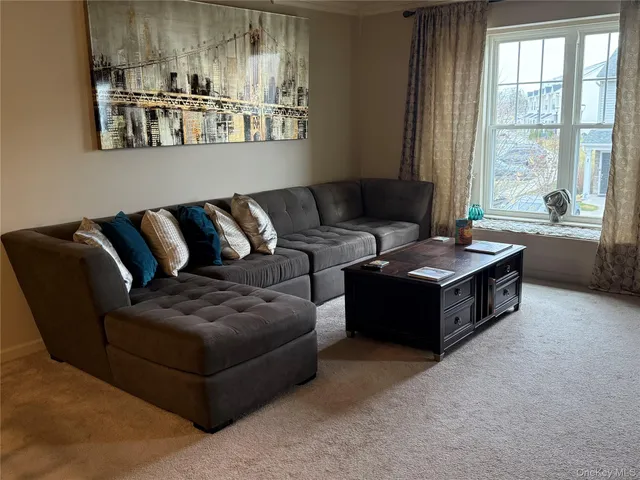 a living room with furniture and window