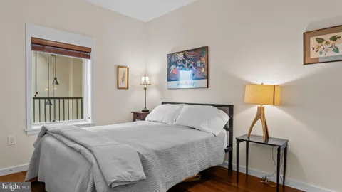 a view of walk in closet with wooden floor