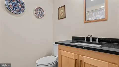 a bathroom with a large mirror a shower and a bathtub