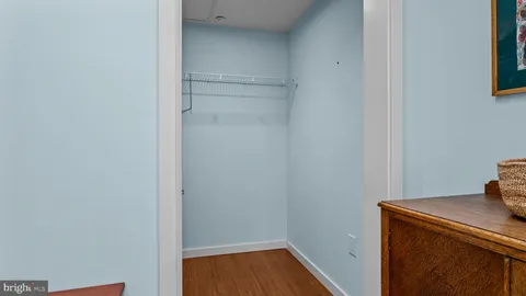 a view of a patio with chair and potted plants