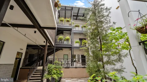 a view of hallway with wooden floor