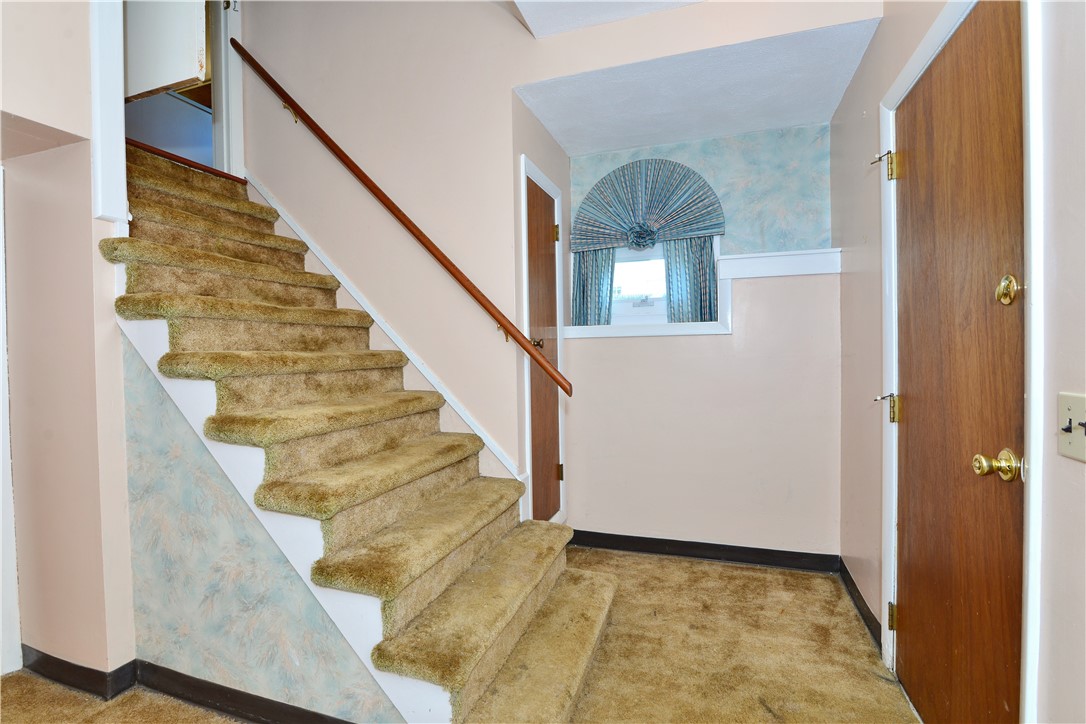 28 Oberlin Drive Warwick, RI 02886 - Photo 30 of 41 Stairs from kitchen leading to lower level family room.
