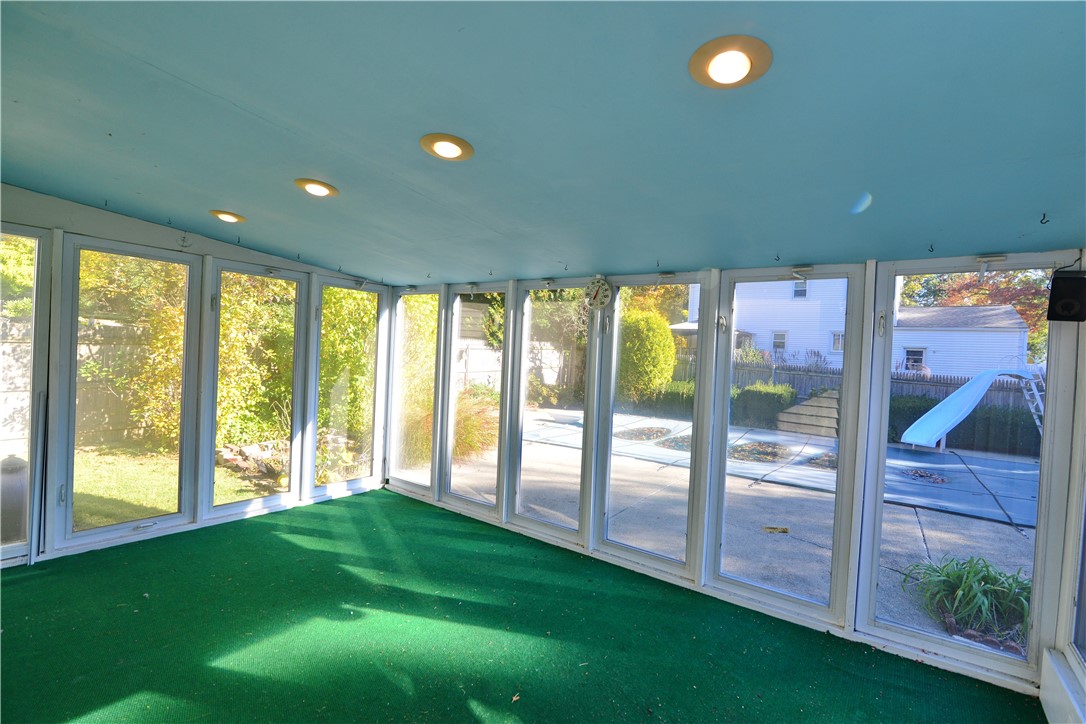 28 Oberlin Drive Warwick, RI 02886 - Photo 33 of 41 3 season sunroom at back of home.