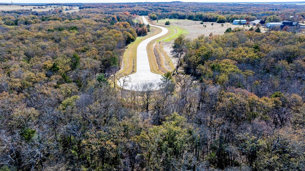 26 Shady Oak Ln Valley View Valley View, TX 76272 - Photo 8 of 14 an aerial view of a house with a yard and lake view