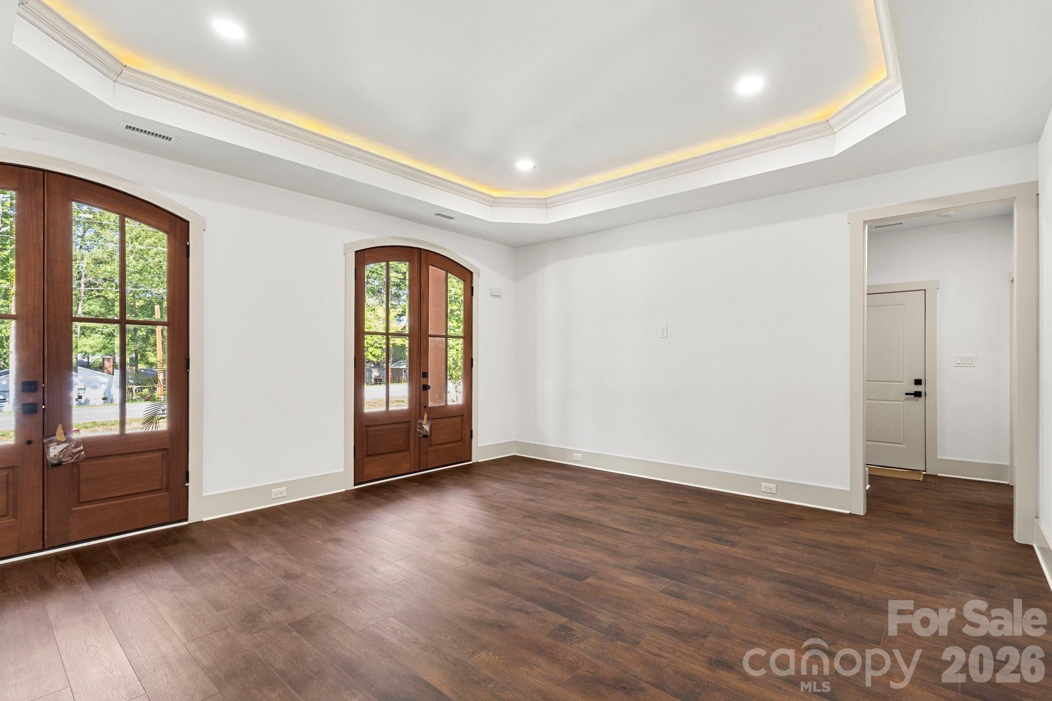 1167 Tirzah Road Rock Hill, SC 29732 - Photo 4 of 25 a view of an empty room with wooden floor and a window