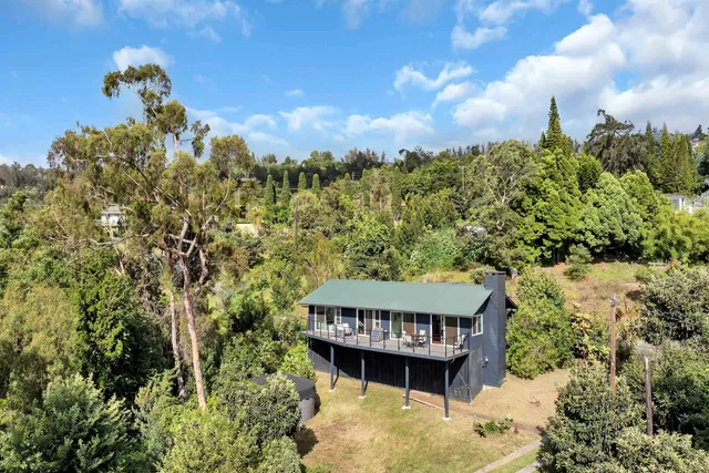 a view of a houses with a yard