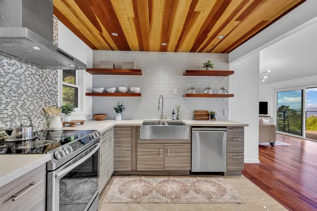 a kitchen with stainless steel appliances wooden cabinets and a sink